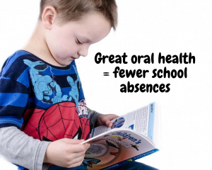 kid reading book and promoting Oral Health in Schools