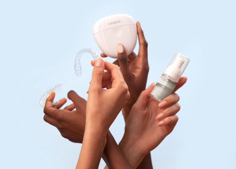 Group of hands holding up a variety of dental solutions for clean teeth